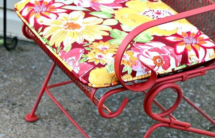 pretty floral outdoor cushions and scarlet spray paint