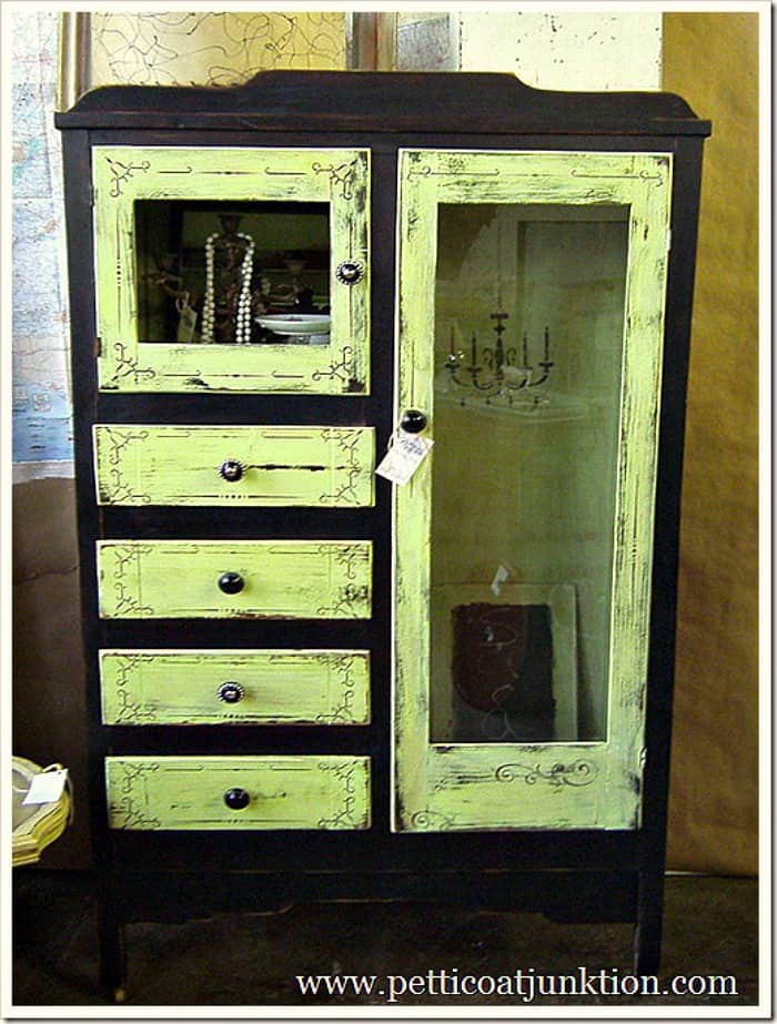 green and black wardrobe with stenciled chandelier