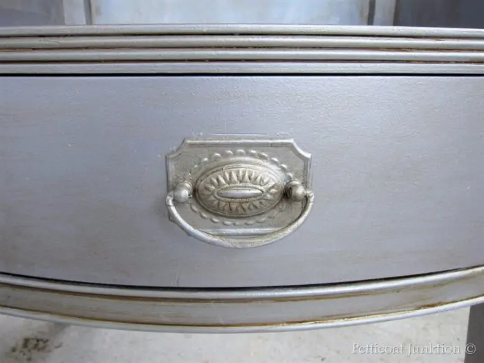silver metallic paint with an antiqued or aged look