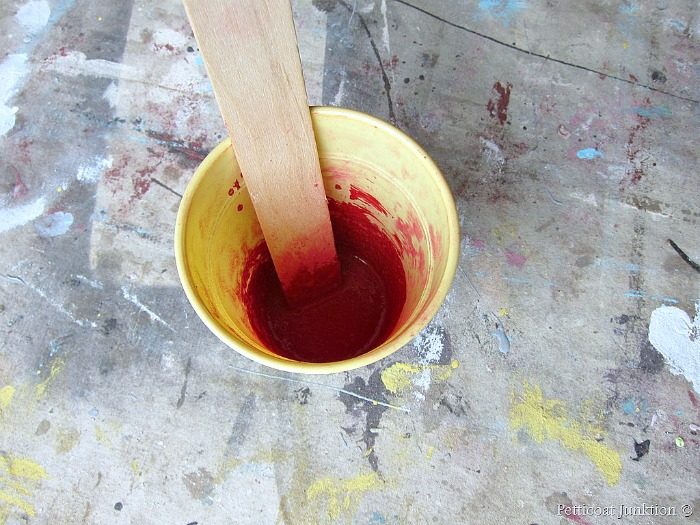 mixing up milk paint in Tricycle red