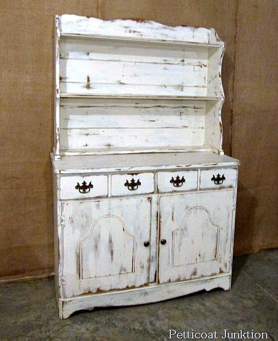 white hutch with distressed paint