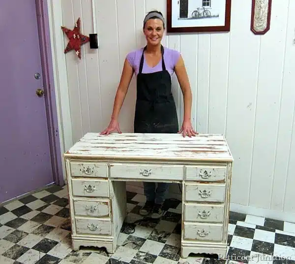 heavily distressed white desk painted at furniture painting workshop