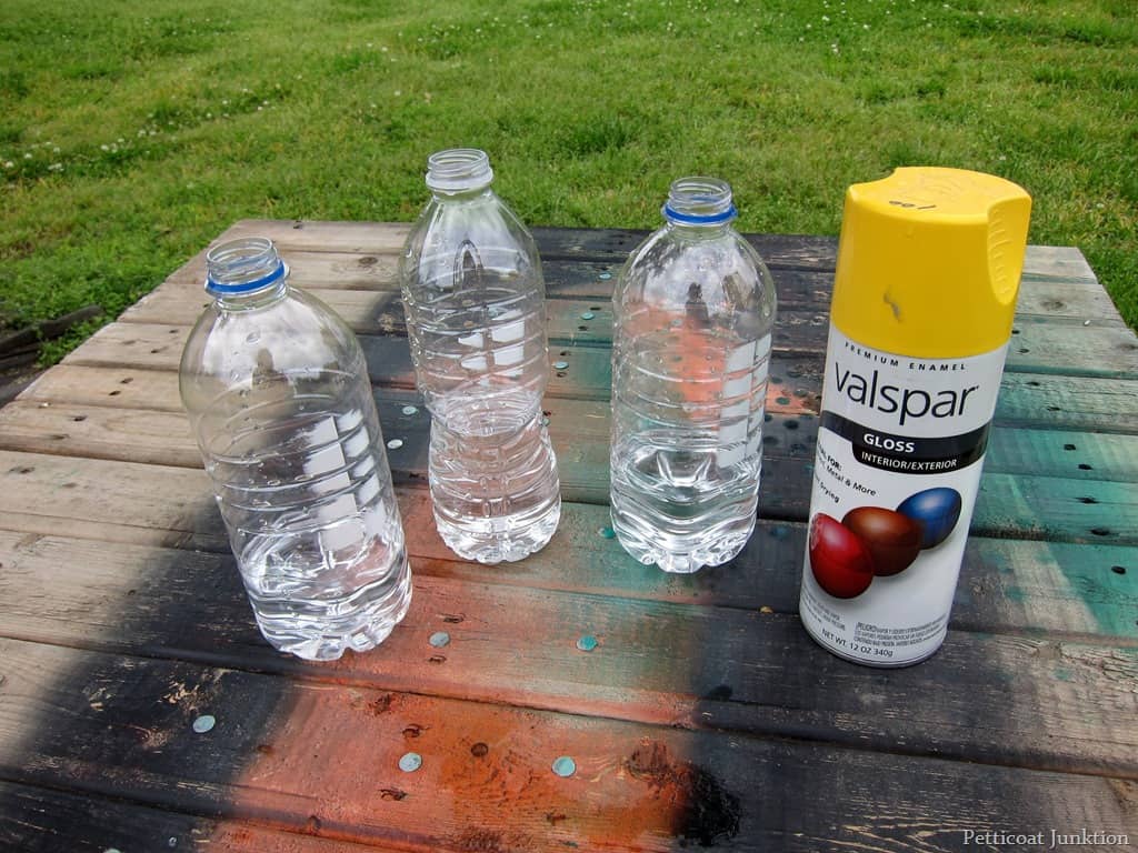 recycled-plastic-water-bottle-vases-spray-painted-yellow