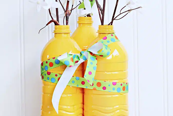wrap ribbon around painted water bottles