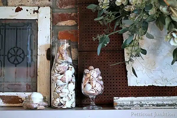 white mantel display with seashells Petticoat Junktion
