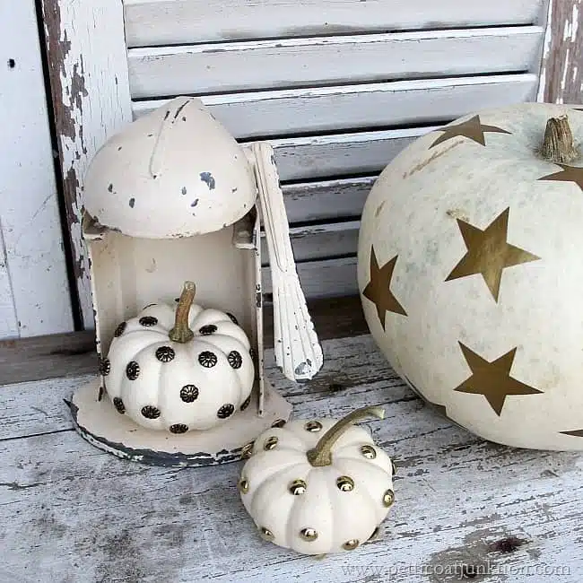 Decorating Small White Pumpkins Using Upholstery Tacks 