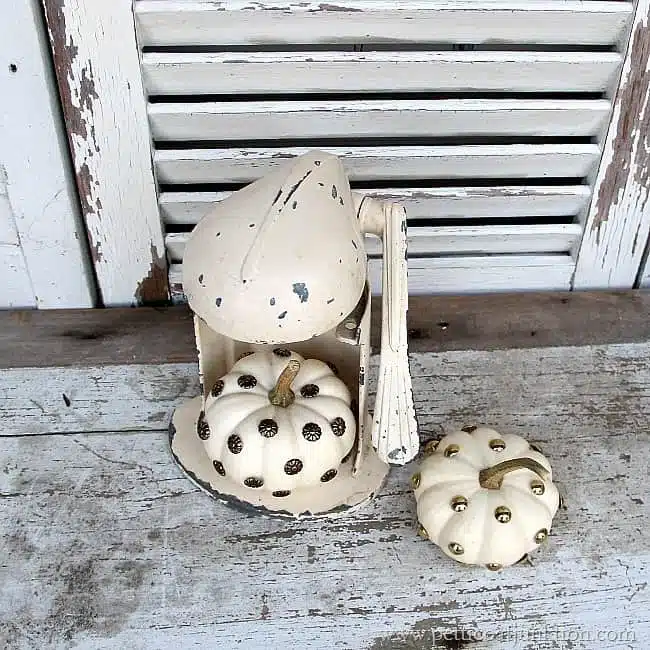 decorating small white pumpkins with upholstery tacks Petticoat Junktion