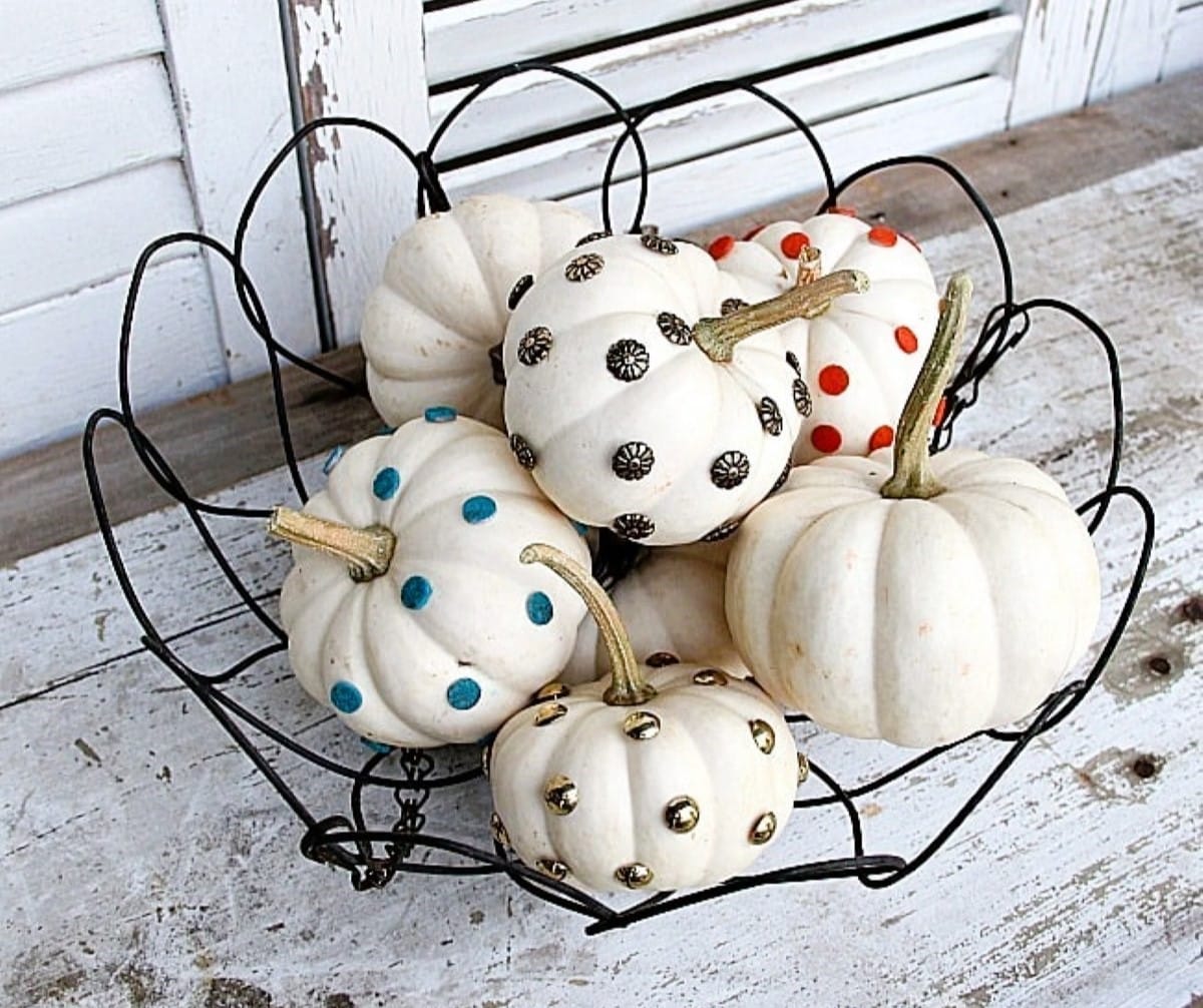 mini pumpkins or small white pumpkins decorated with tacks