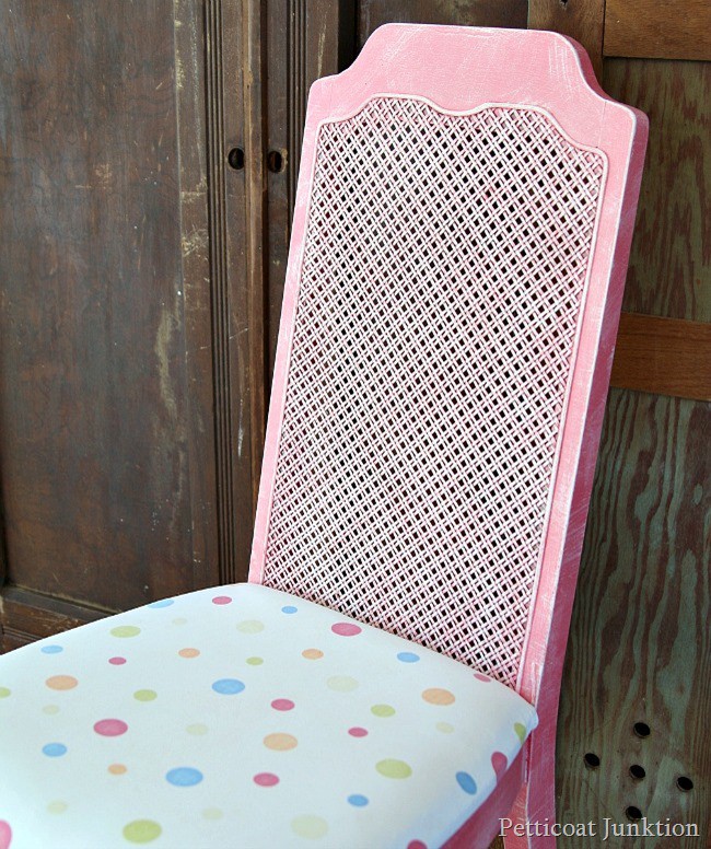 The cane back chair makeover includes a new seat cover made from a vintage pillowcase. I love this style of chair. The cane looks great painted. Petticoat Junktion