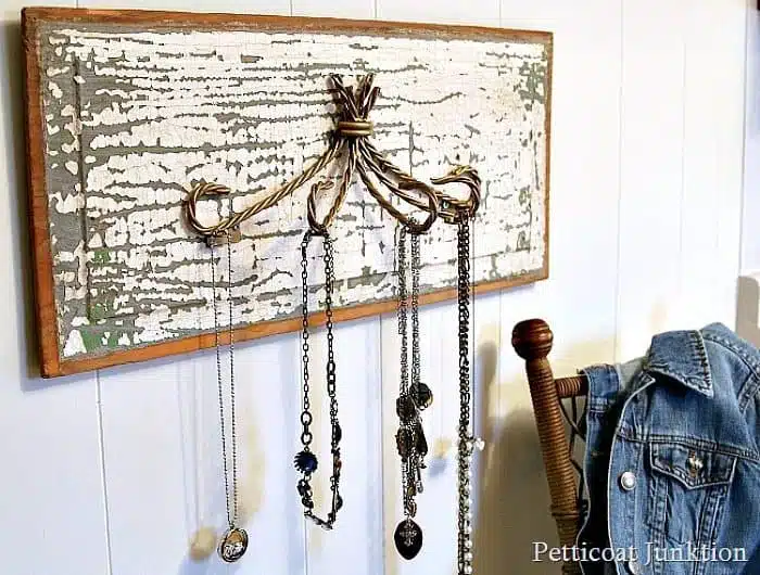 a close up look at the necklace hanger made from reclaimed pieces