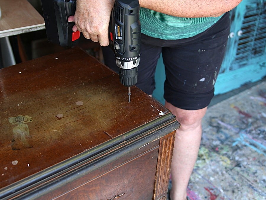 how to permanently secure the top of a sewing cabinet to the base