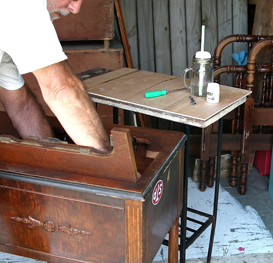remove an old sewing machine from the cabinet