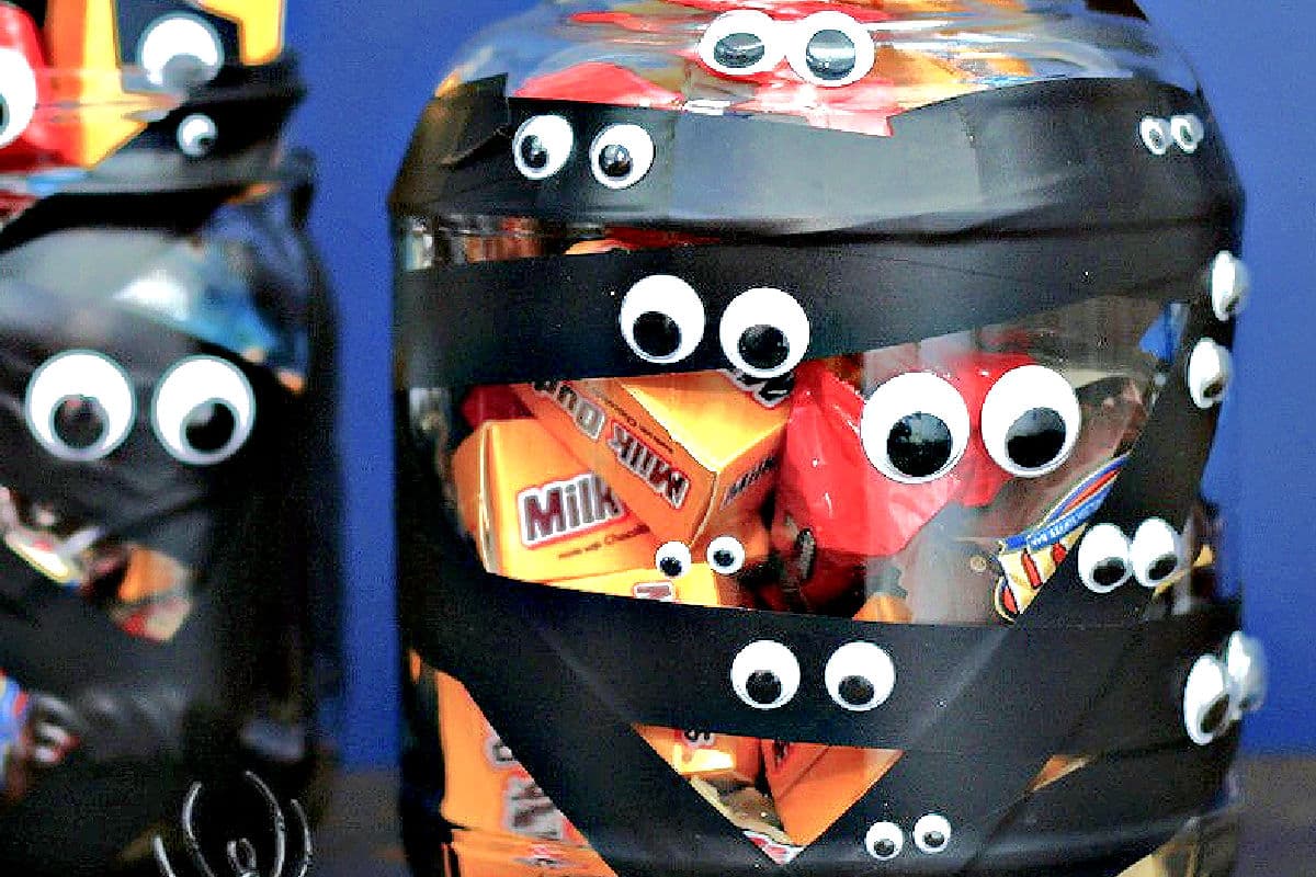 googly eyes and black electrical tape diy with glass jars for candy display