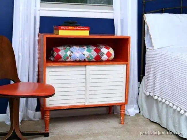 orange furniture pops against a blue wall Petticoat Junktion