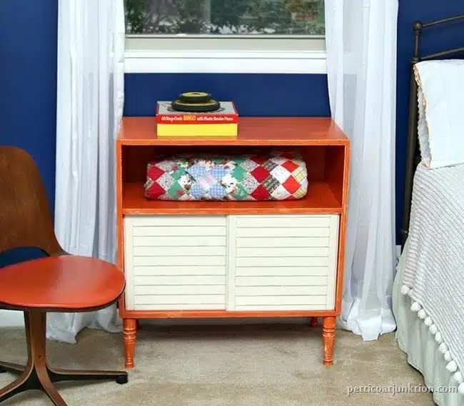 orange furniture pops against blue walls Petticoat Junktion
