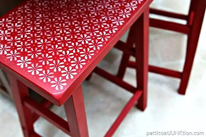 red bar stool with stenciled design