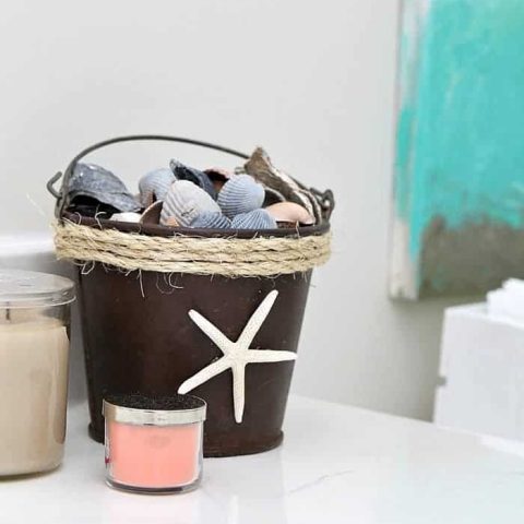 sisal rope wrapped rusty seashell bucket