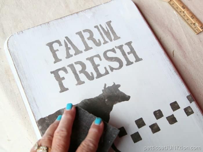 distress a stencil for the perfect farmhouse style sign