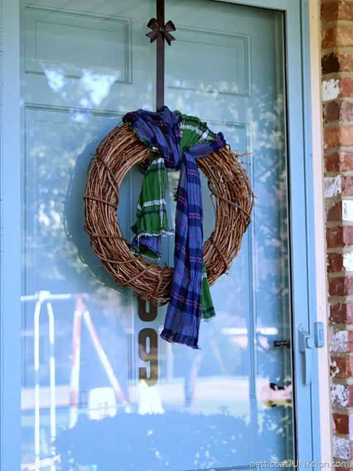 Tie a multi-color scarf around a grapevine wreath for a simple and easy update