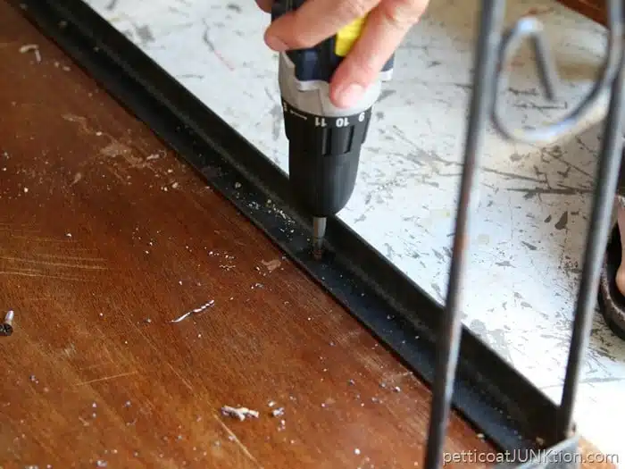 attaching table top to metal stand 