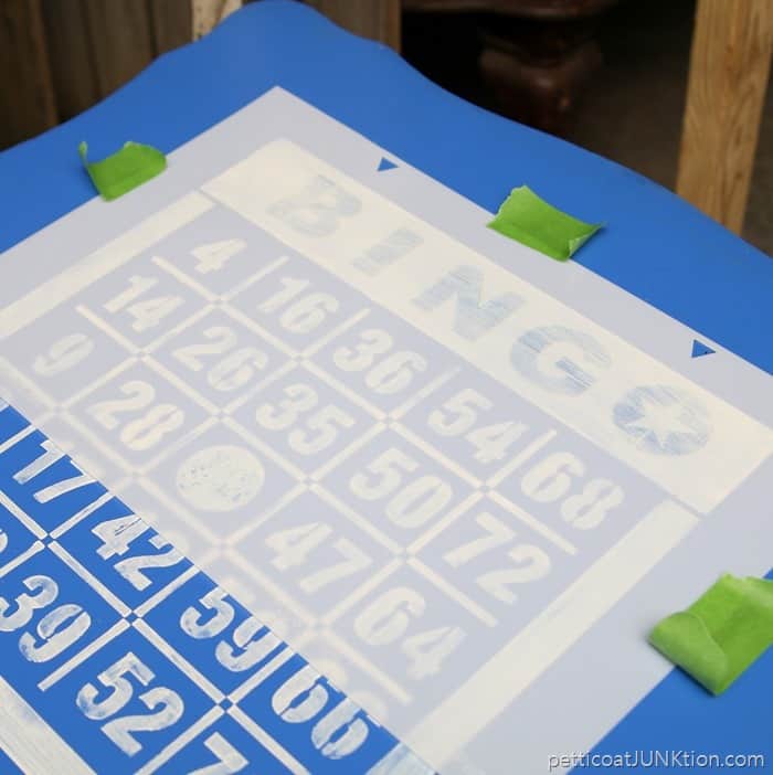 tape second layer of bingo stencil to table