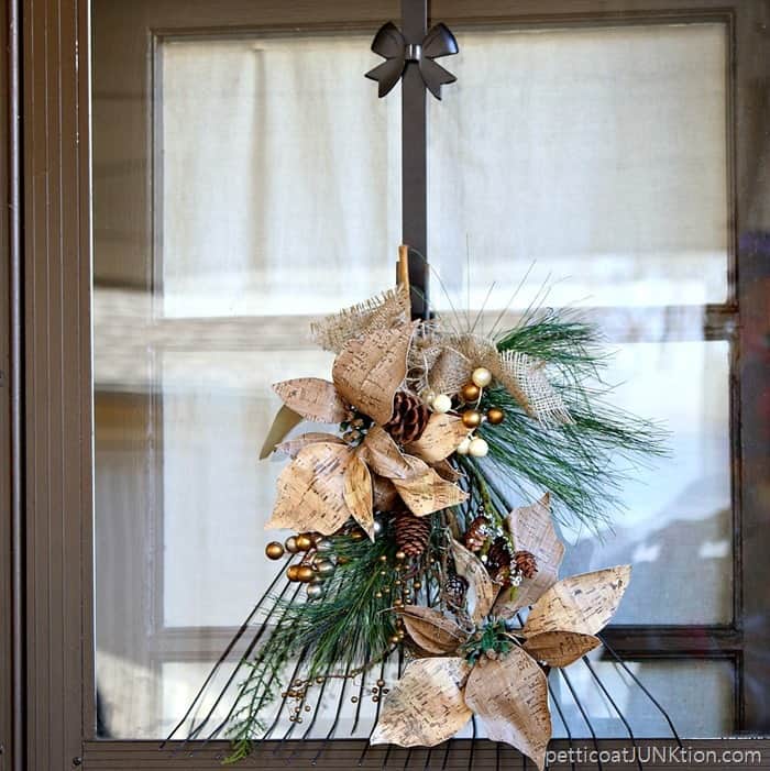 Rake Wreath made with poinsettias and pine cones