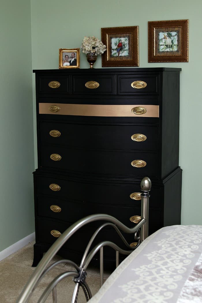 black furniture with painted gold stripe
