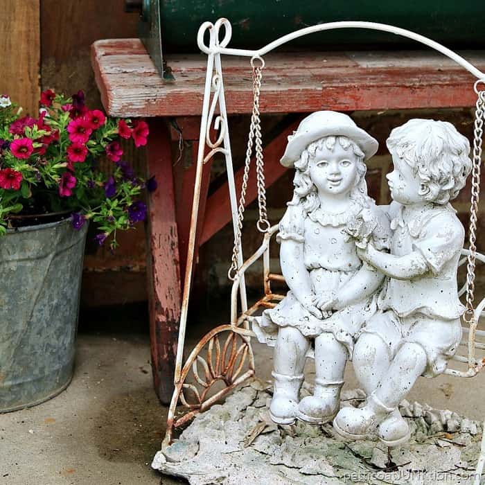 boy and girl garden statues