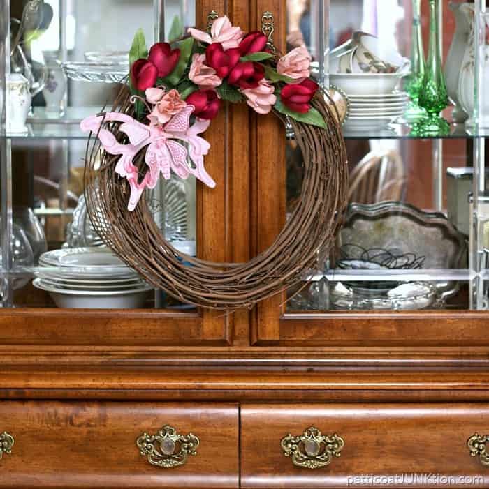 pink butterfly wreath is made from thrifty finds 