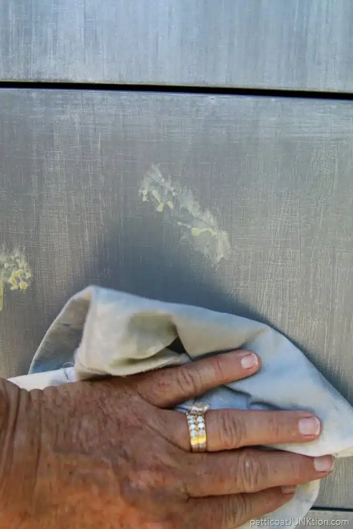 applying metallic paint with a rag