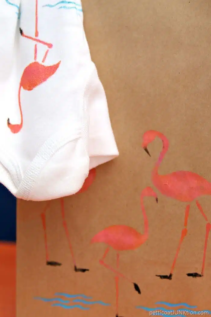 cute pink flamingo gift bag with stenciled onesie for new baby