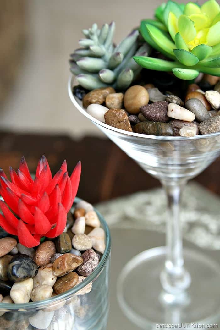 faux red succulent in thrift store glass container