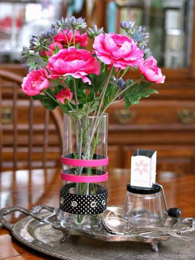 trash to treasure makeover using recycled belts to decorate a glass vase