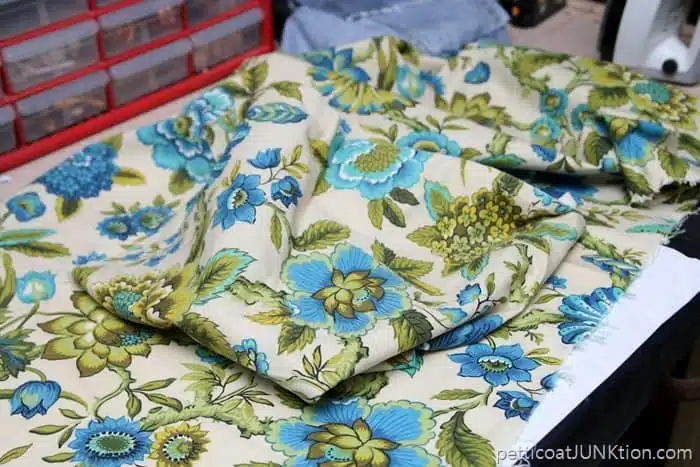 thrift store fabric with pretty design in blue, turquoise, and green