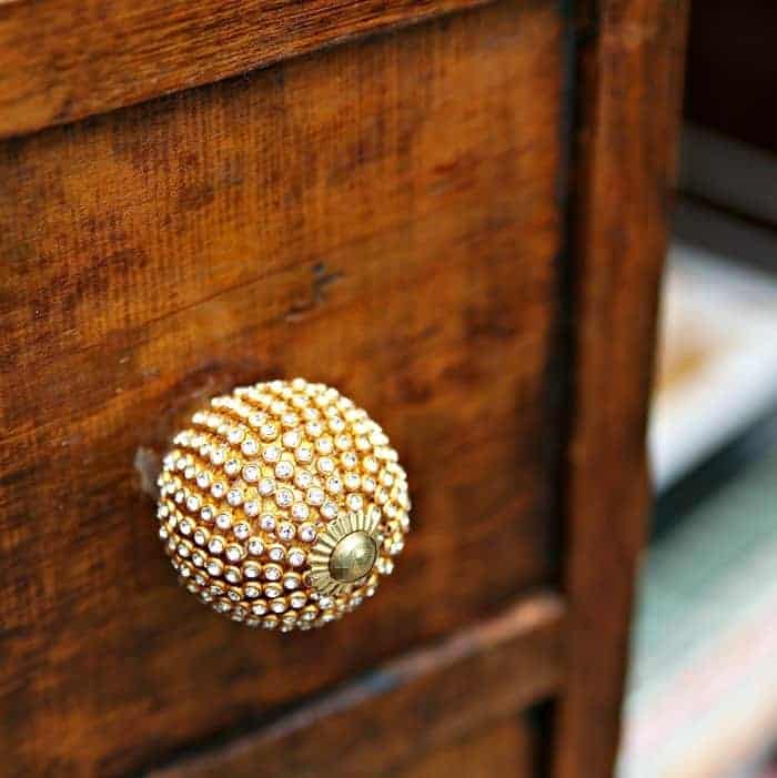 vintage wardrobe with blingy knobs and a chandelier