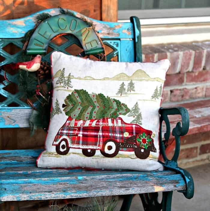 Christmas pillow from World Market spruces up shabby outdoor chair