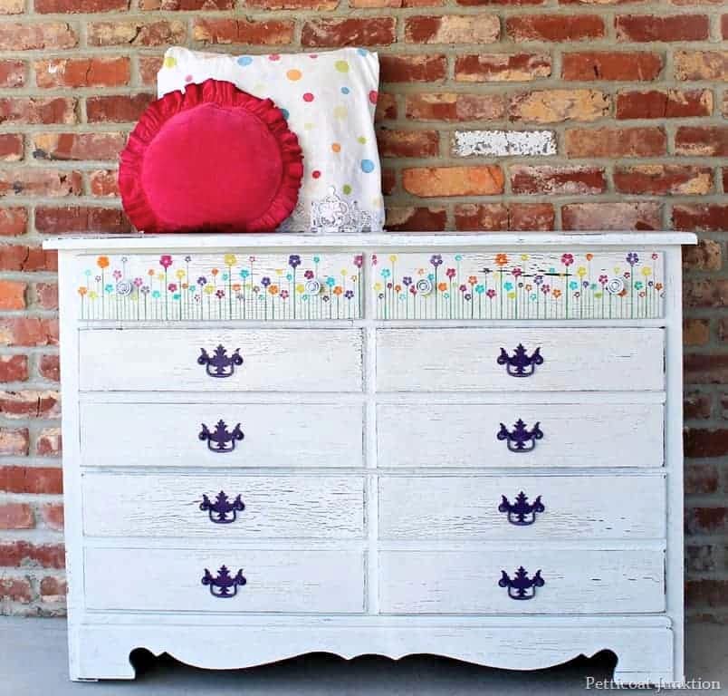 how to add colorful stenciled flowers to a white dresser