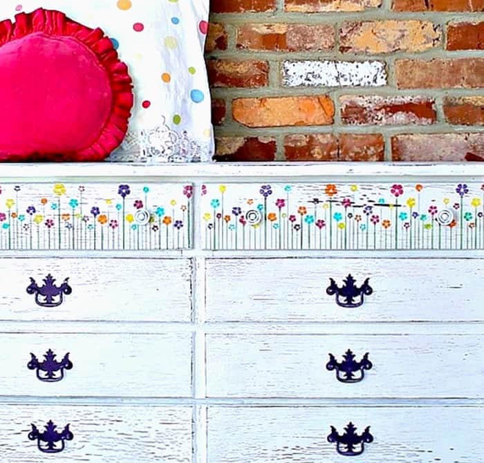 how to stencil colorful flowers on a white dresser