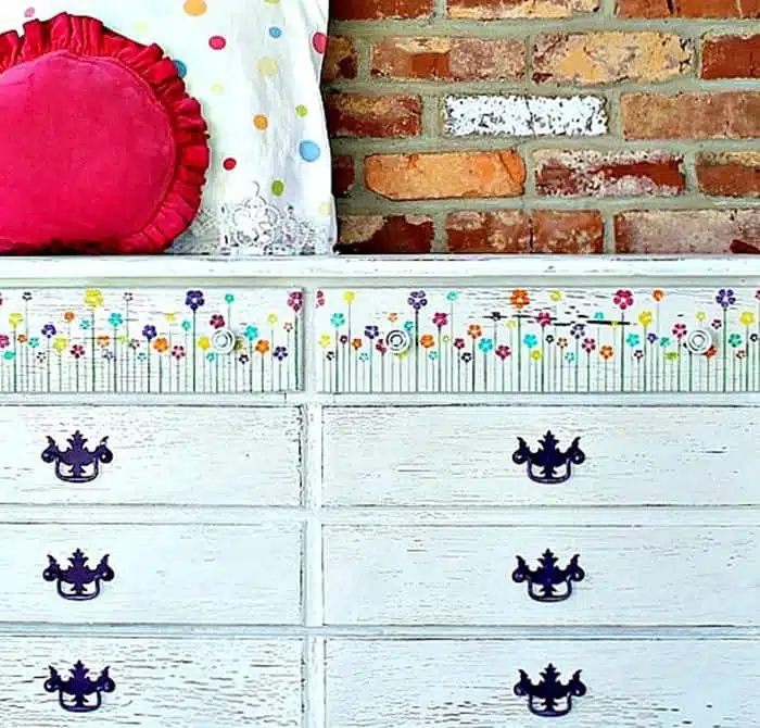 white dresser with pretty stenciled flowers