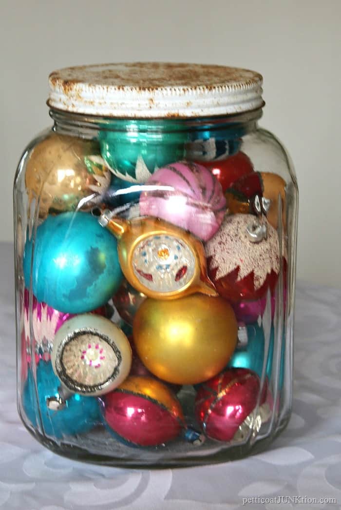 Vintage Christmas ornaments in a glass jar