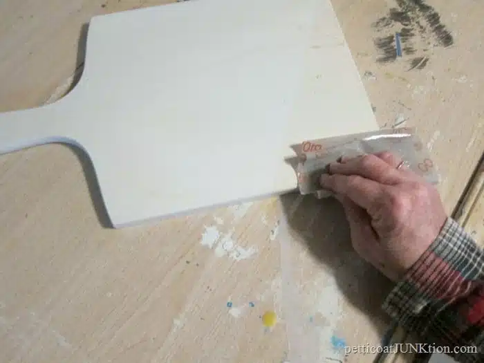 distress paint with flexible sandpaper