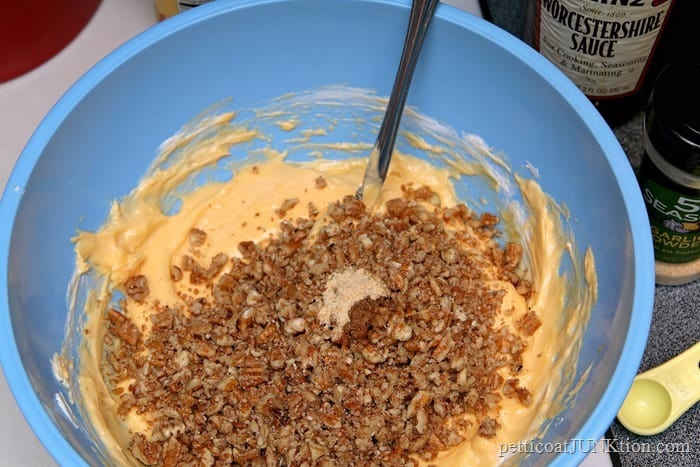 mixing up a pecan chili powder cheese ball