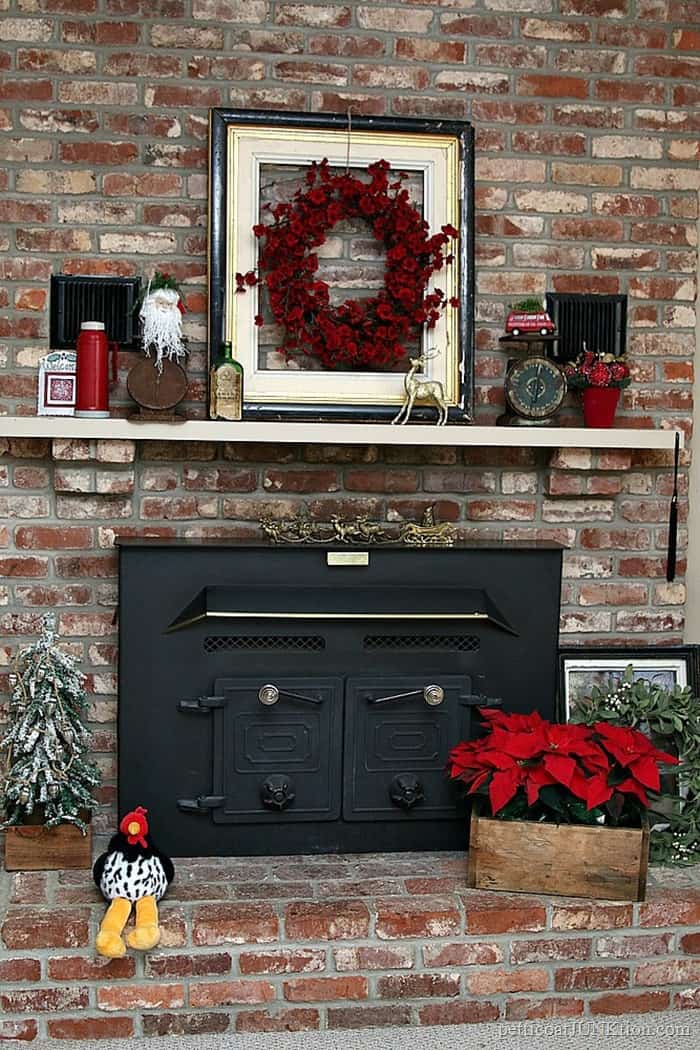 red and rust color scheme for decorating the Christmas mantel