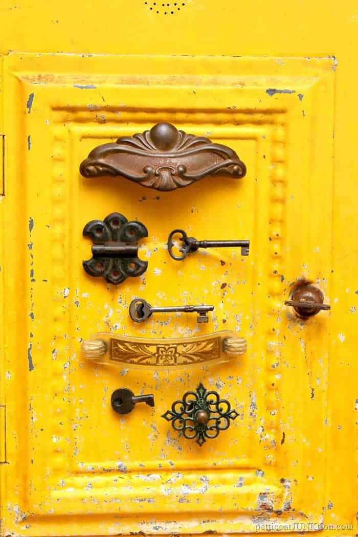 diy magnets made from vintage finds displayed on a yellow metal box