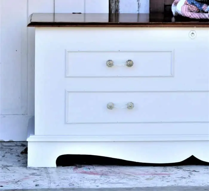 paint a cedar chest white and change the drawer pulls for a modern look