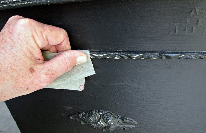 Distressing layers of crackled paint