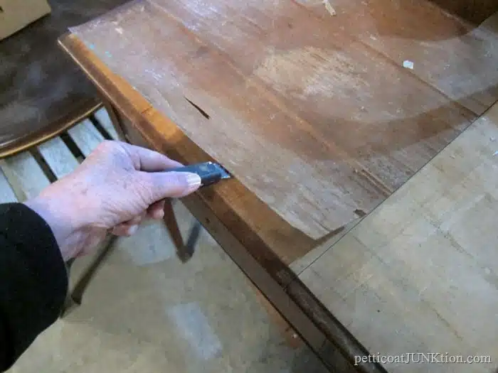 removing loose veneer