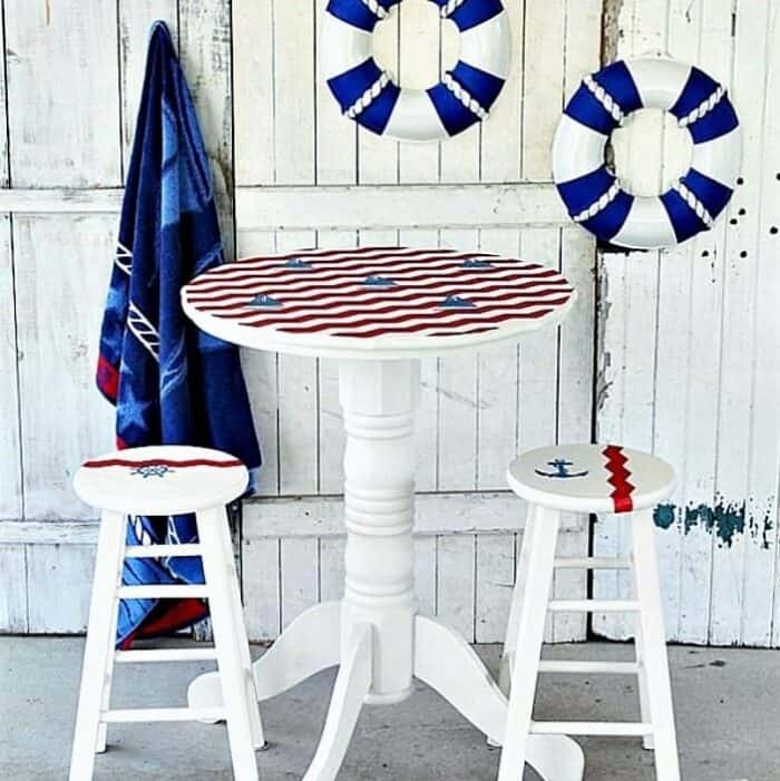 Pub table painted in a Nautical theme with colors red white and blue