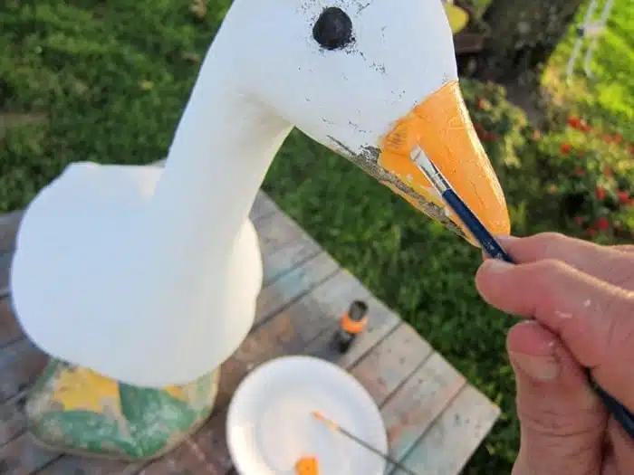 repainting a lawn statue