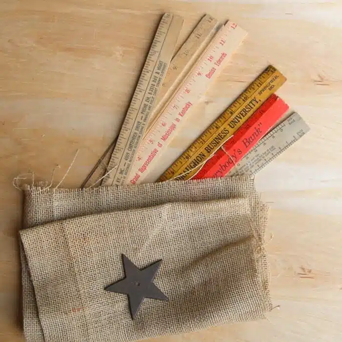 supplies to make a rustic flat using wood rulers and Duck Tape